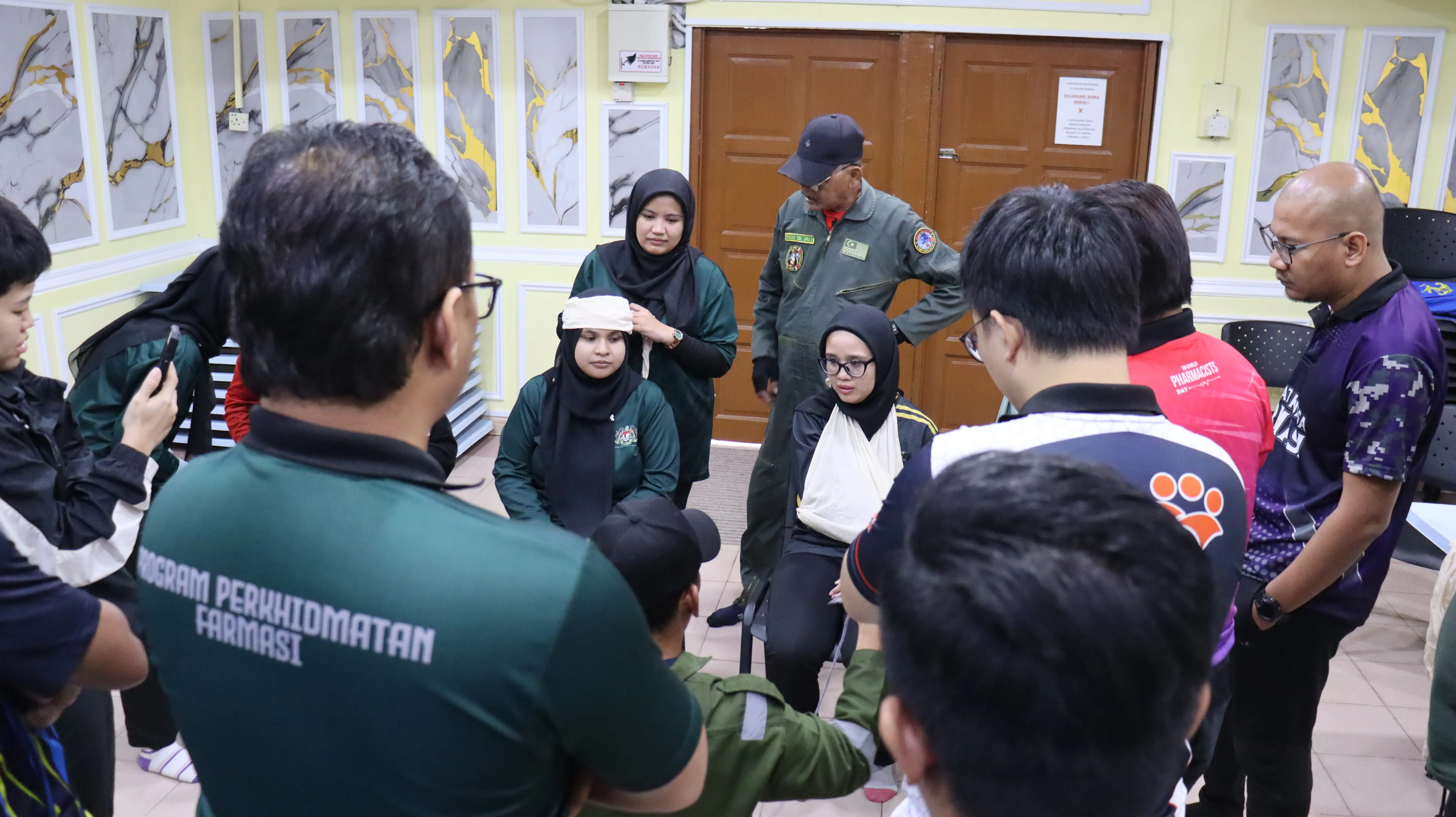 Participants taking part in practical CPR and first aid training in Malaysia